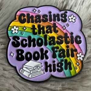 Chasing That Scholastic Book Fair High Enamel Pin